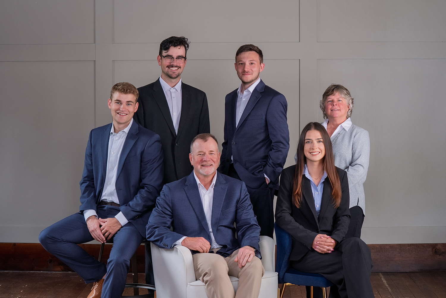 Professional corporate team portrait of six business people in suits, photographed in Springboro, Ohio. Business headshots and group photography for company branding.